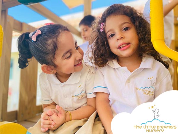 two-cute-girls-in-the-playground-of-a-nursery-in-Dubai with no separation anxiety